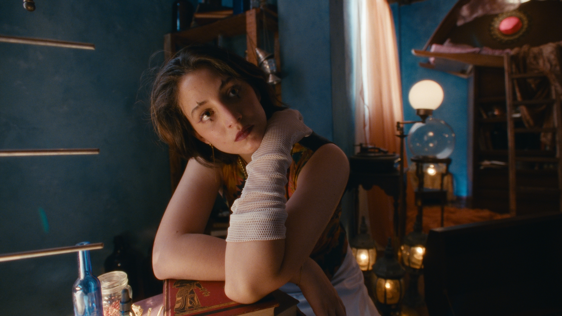Uma leaning on a counter in the blue room